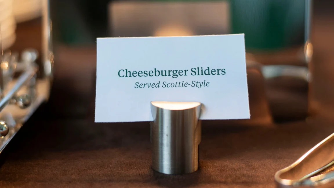 An image of a menu card reading 'cheeseburger sliders, served Scottie-style'