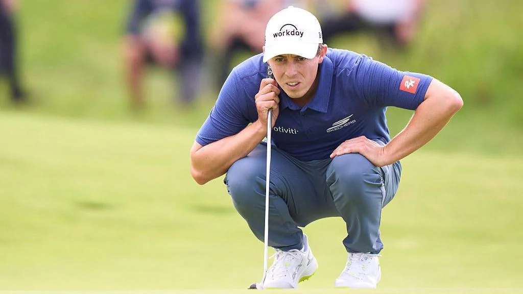 Matthew Fitzpatrick lines up a putt