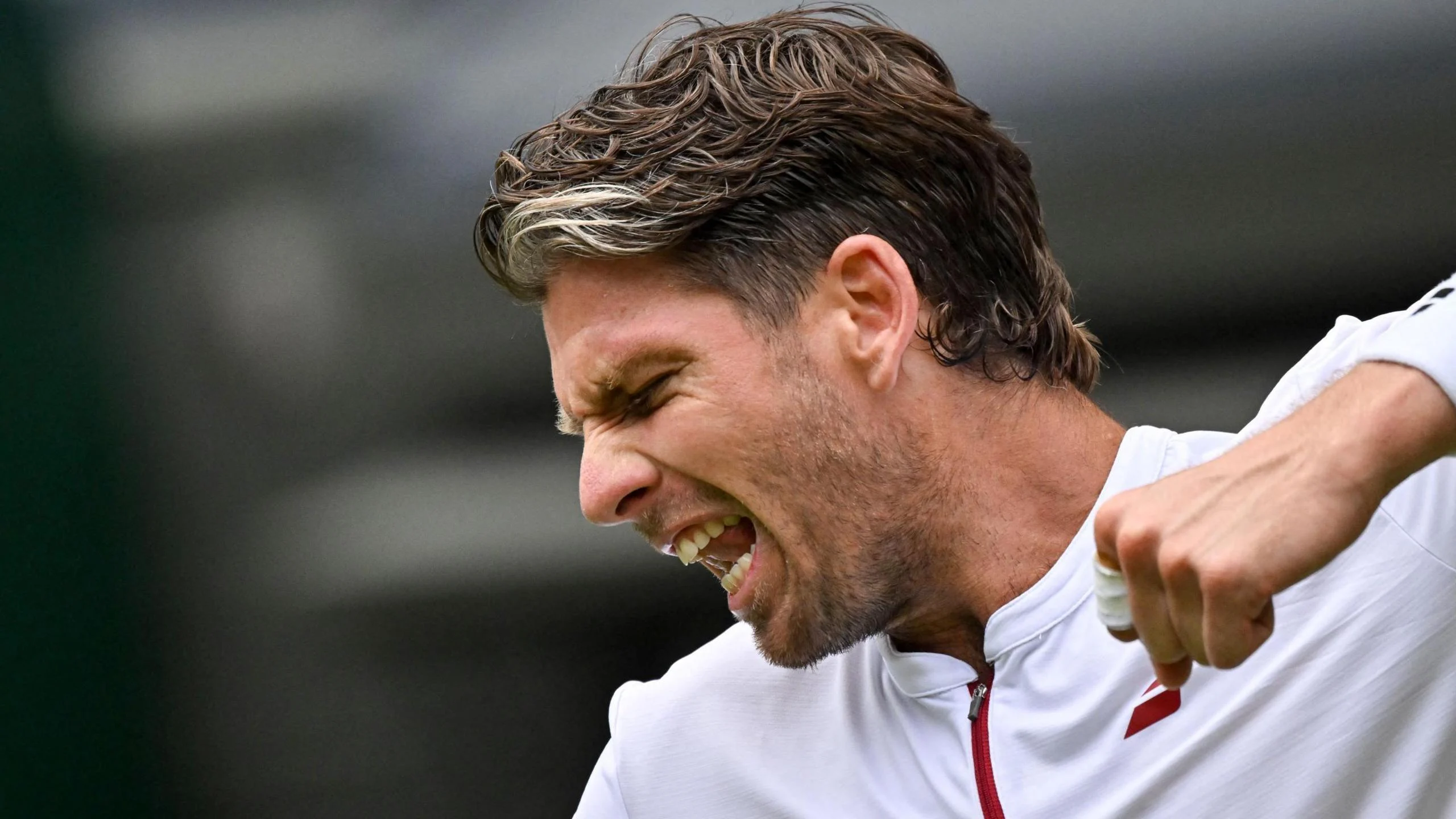 Cameron Norrie celebrates beating Nicolas Jarry at Wimbledon