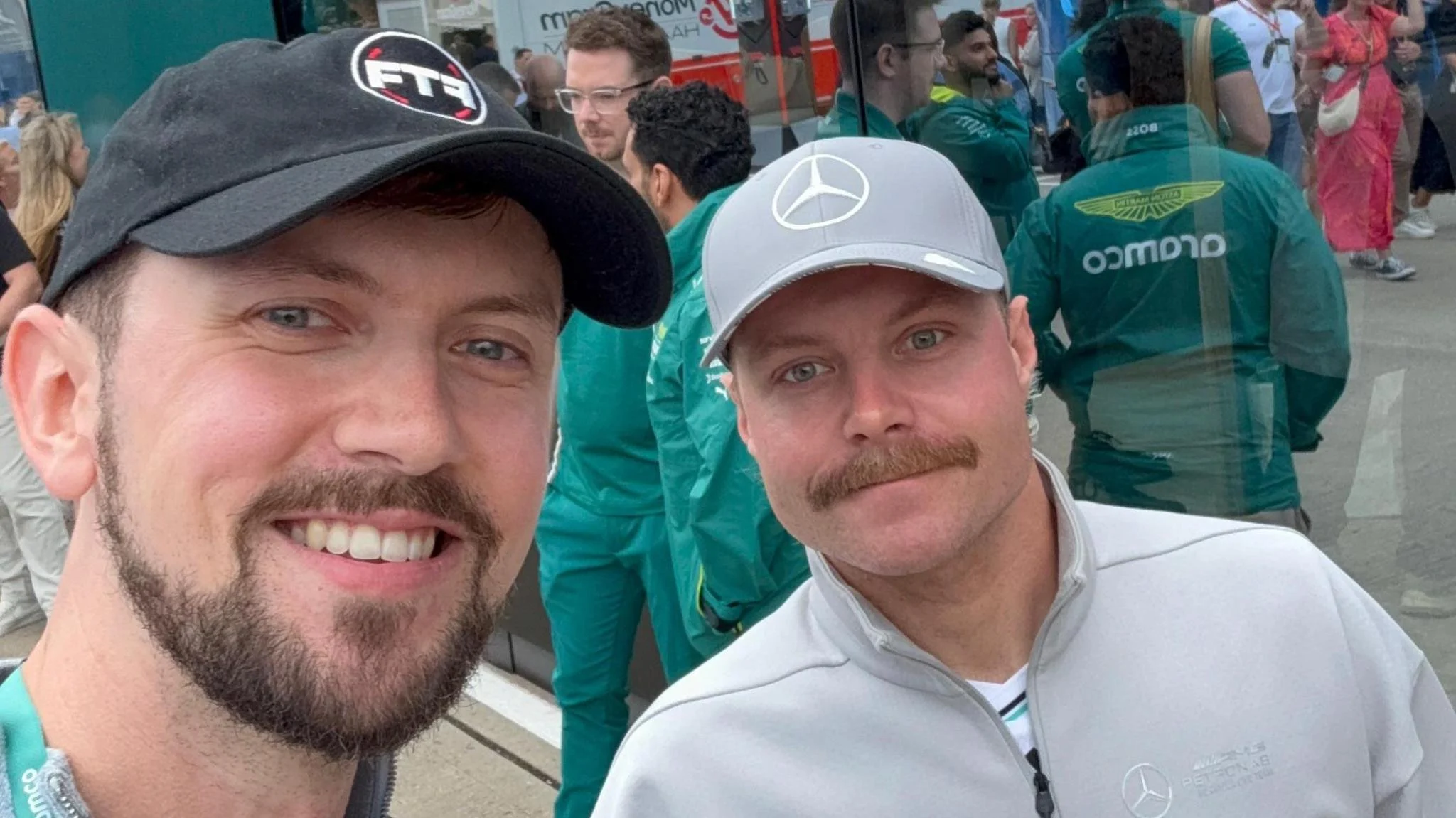 Brandon Burgess and Valtteri Bottas pose for a selfie