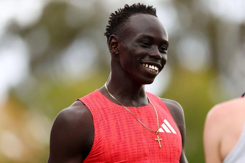 Gout Gout smiles on the track before competing in a sprint event in Peth, Australia.