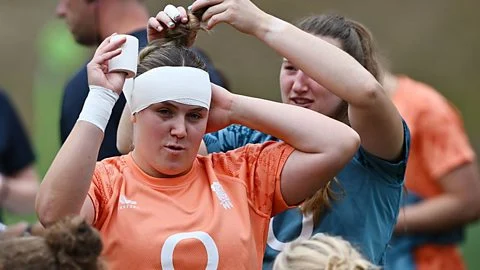 Mackenzie Carson of England has a bandage put on their head during the England Red Roses training session