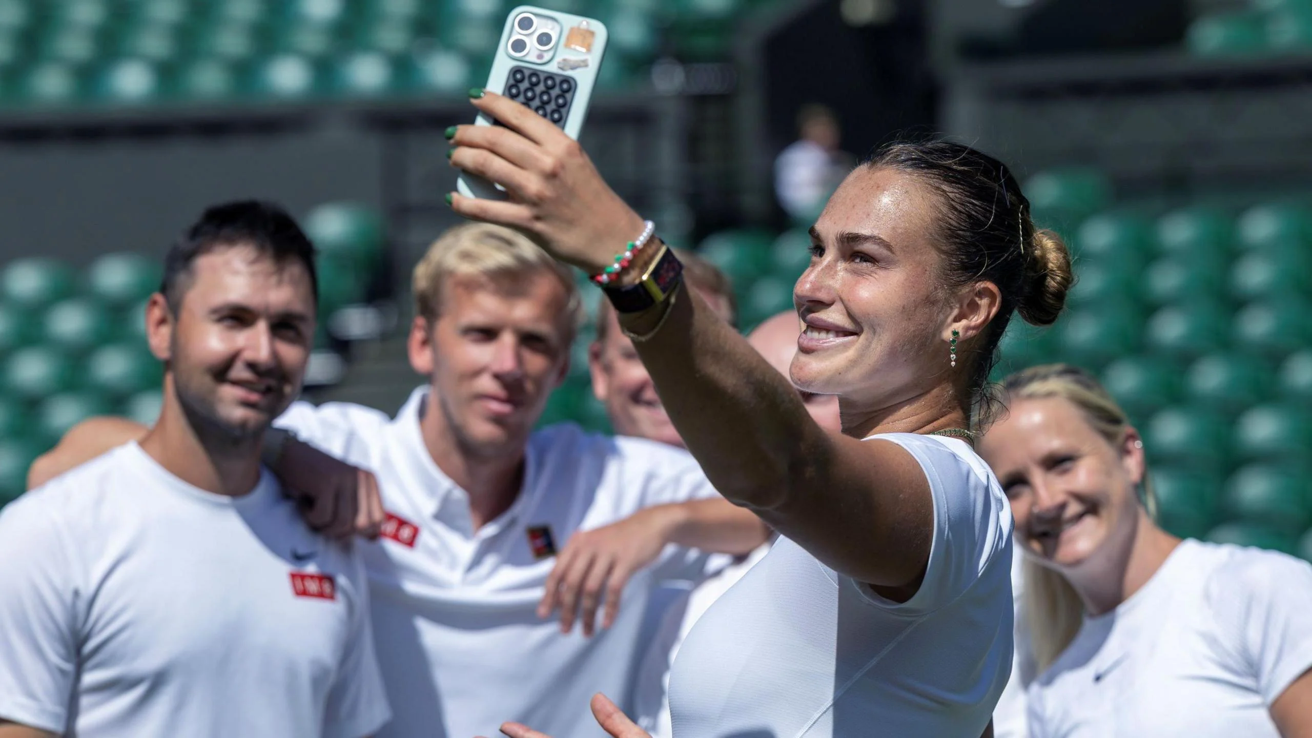 Aryna Sabalenka takes a selfie with her team at Wimbledon