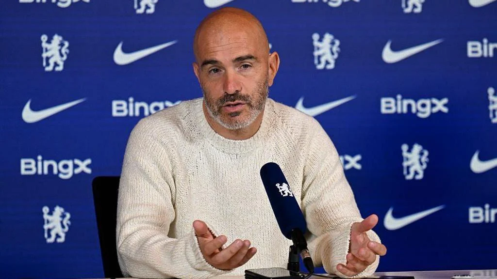 Enzo Maresca talks into a microphone at a news conference