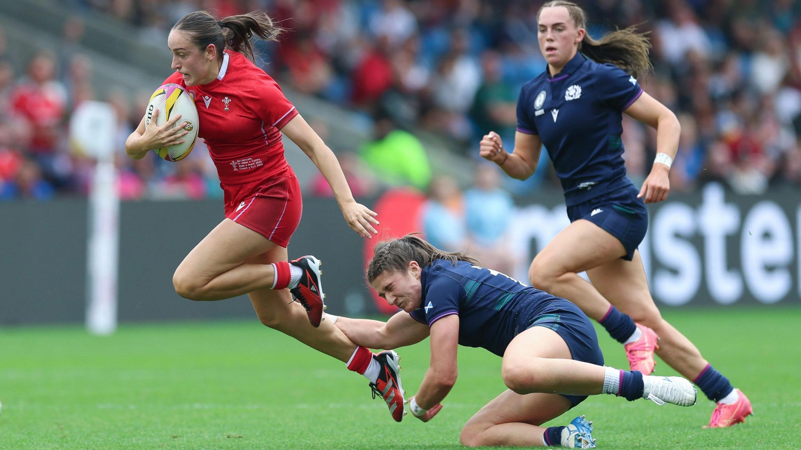 Nel Metcalfe makes a break for Wales against Scotland 