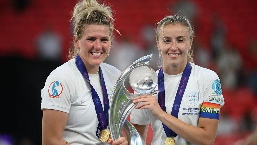Millie Bright and Leah Williamson with the Euro 2022 trophy