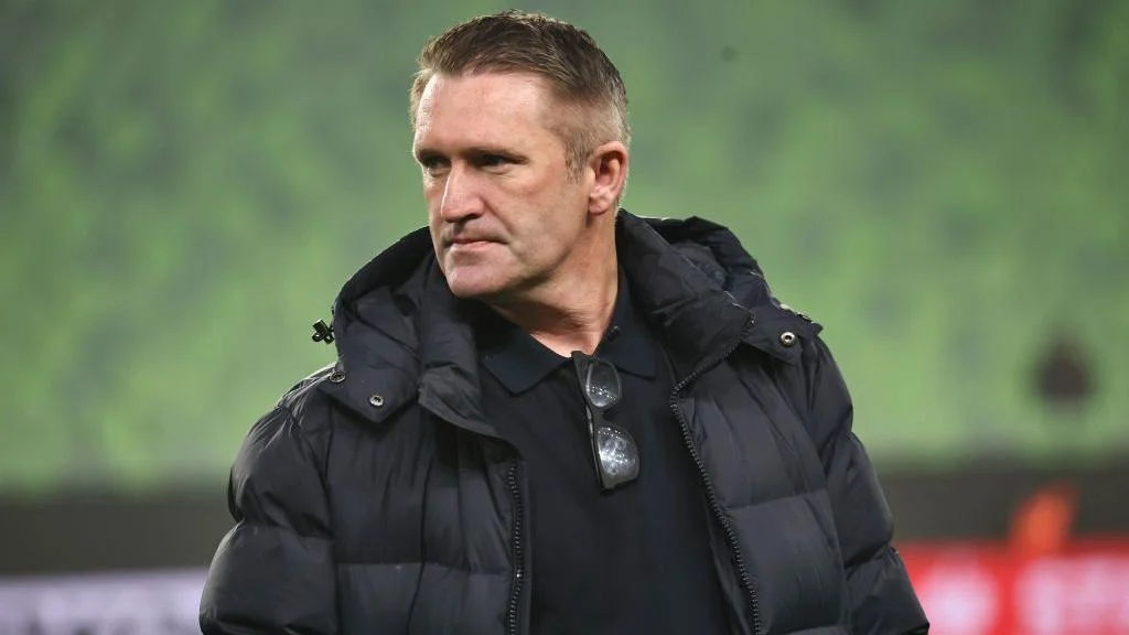 Robbie Keane wearing a black coat