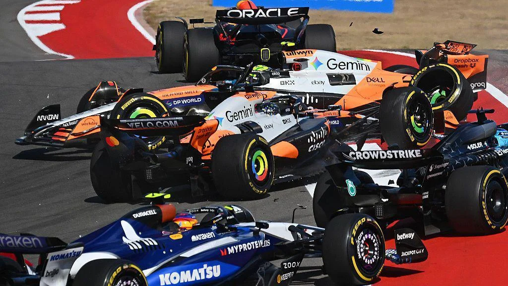 Oscar Piastri and Lando Norris collide at the first corner in the US Grand Prix sprint race