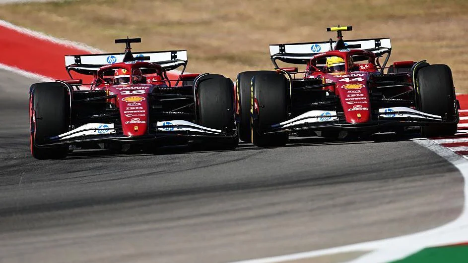 The Ferraris of Charles Leclerc and Lewis Hamilton side by side while battling for third position during the United States Grand Prix