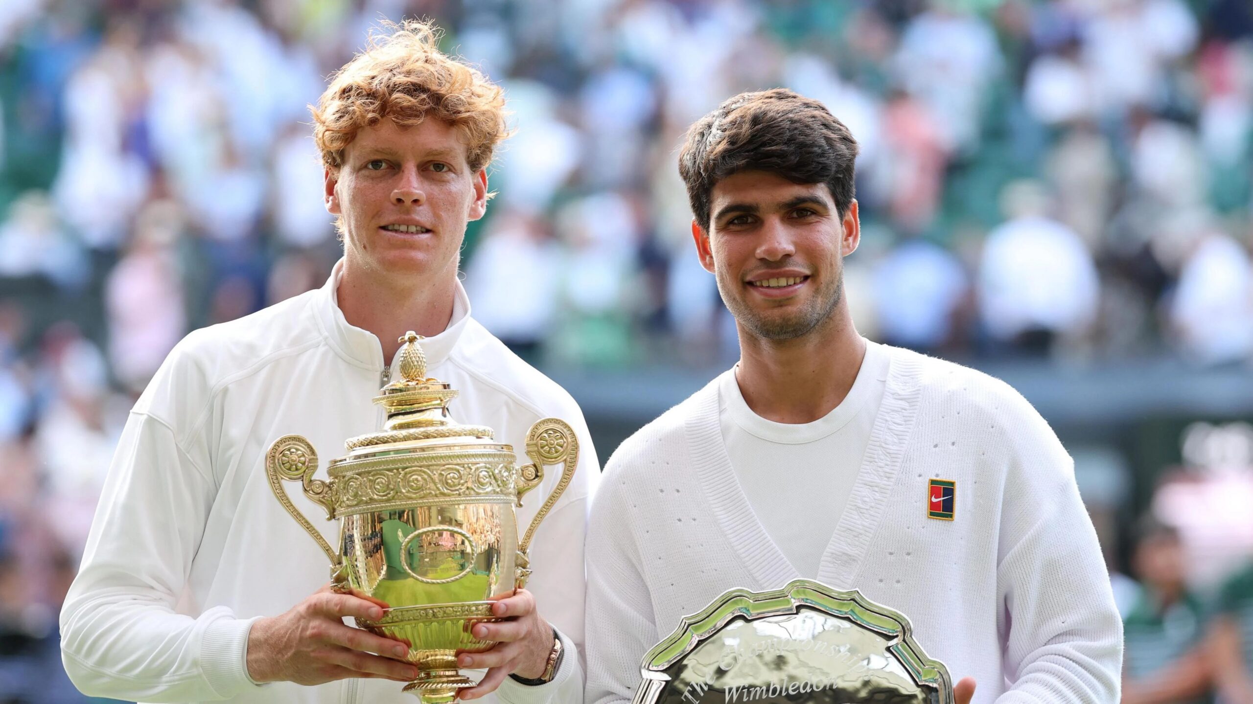 Jannik Sinner and Carlos Alcaraz pose with their Wimbledon trophies